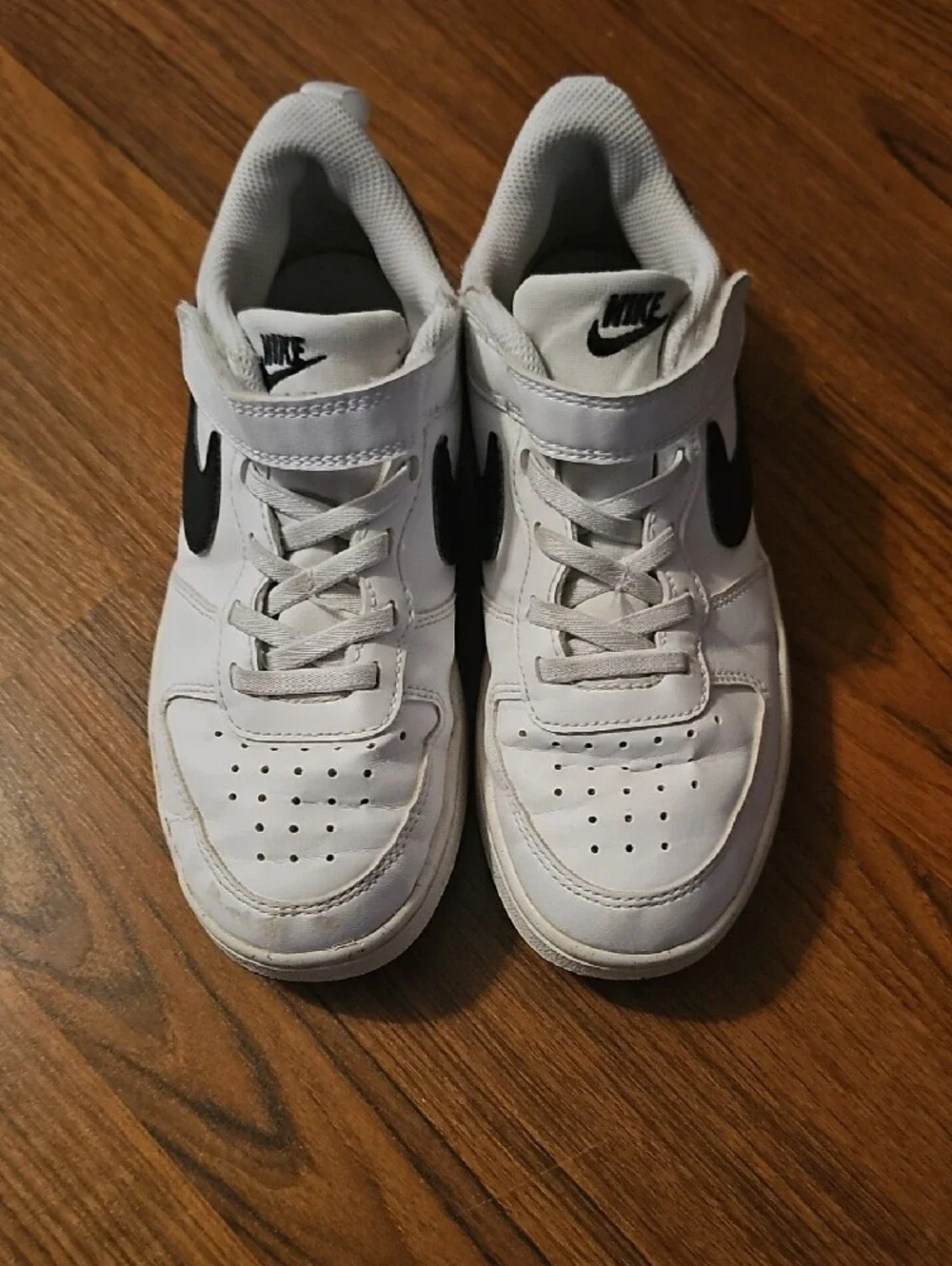 Nike Kids White Sneakers with Black Swoosh
